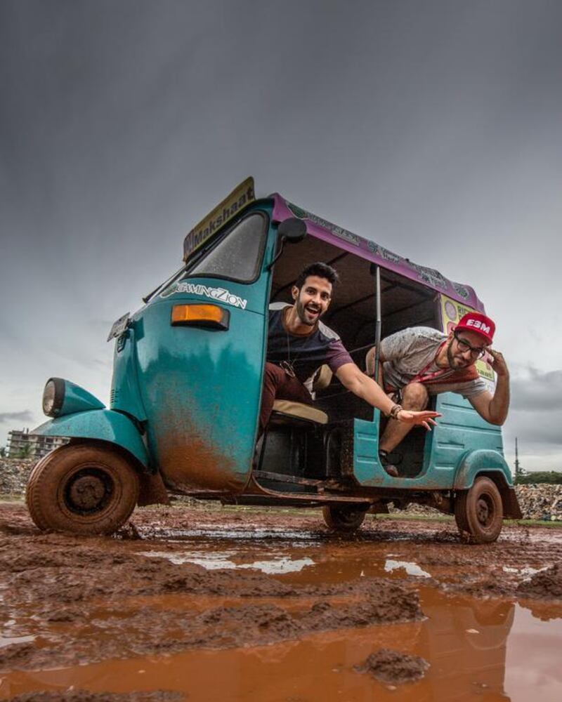 Emirati Peyman Al Awadhi, right, and Abdullah Al Jumah, from Saudi Arabia, will visit seven cities in their three-wheeler in their 1,200-kilometre Rickshaw Challenge across India. Courtesy Peyman Al Awadhi