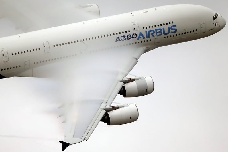 FILE - In this June 18 2015 file photo, vapour forms across the wings of an Airbus A380 as it performs a demonstration flight at the Paris Air Show, Le Bourget airport, north of Paris. A World Trade Organization panel ruled Tuesday, May 15, 2018 that the European Union continues to provide illegal subsidies to plane-maker Airbus, the latest in a string of tussles between the European manufacturer and U.S. rival Boeing. (AP Photo/Francois Mori, File)