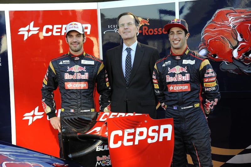 Pedro Miro, the Cepsa executive, centre, with Jean-Eric Vergne of France, left, and Daniel Ricciardo, during Scuderia Rosso’s launch of its STR8 Formula One car. Courtesy Cepsa