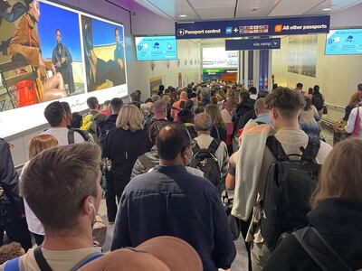 People wait in a corridor at Heathrow Airport on Wednesday morning to have their passport's checked. Photo: Jamie Heath / Twitter