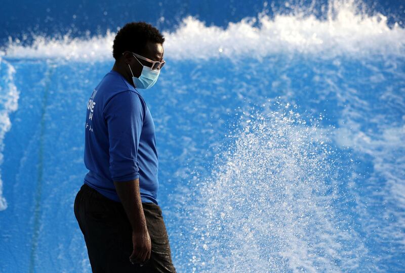 Dubai, United Arab Emirates - Reporter: N/A. News. Covid-19/Coronavirus. A member of staff at Town square wears a protective face mask as checks the water at the Wave rider. Friday, July 3rd, 2020. Dubai. Chris Whiteoak / The National