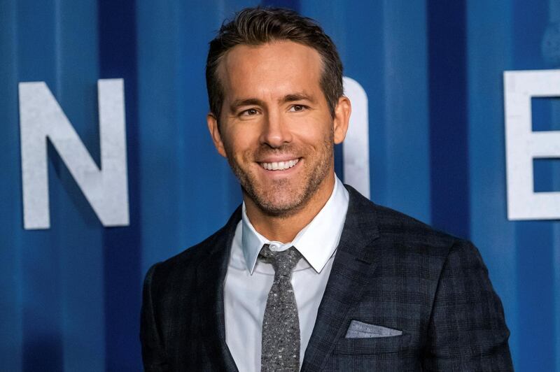 FILE - In this Tuesday, Dec. 10, 2019 file photo, Ryan Reynolds attends the premiere of Netflix's "6 Underground" at The Shed at Hudson Yards on in New York. Hollywood stars Ryan Reynolds and Rob McElhenney could be getting into the soccer business. Wrexham is a Welsh team which plays in the fifth tier of English soccer. It has revealed on Wednesday, Sept. 23, 2020 that Reynolds and McElhenney are the ‚Äútwo extremely well-known individuals‚Äù the club has previously said are interested in investing 2 million pounds ($2.5 million). (Photo by Charles Sykes/Invision/AP, file)