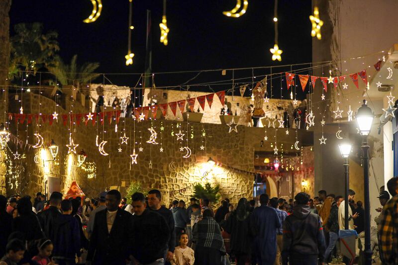 Libyans gather in Tripoli following iftar. AFP