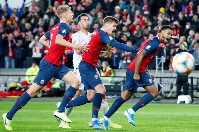 Norway's Kristoffer Ajer, Alexander Soerloth Joshua King celebrate after 1-1 during the UEFA Euro 2020 qualifying Group F soccer match between Norway and Spain at Ullevaal Stadium in Oslo, Norway. AP