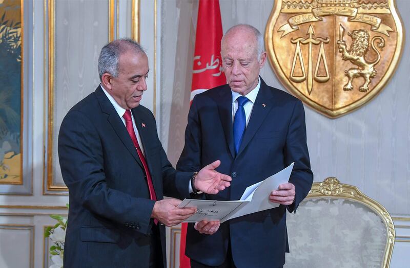 Tunisia's Prime Minister-designate Habib Jemli submits a proposed cabinet to President Kais Saied, at the presidential palace in the capital's eastern suburb of Carthage. AFP