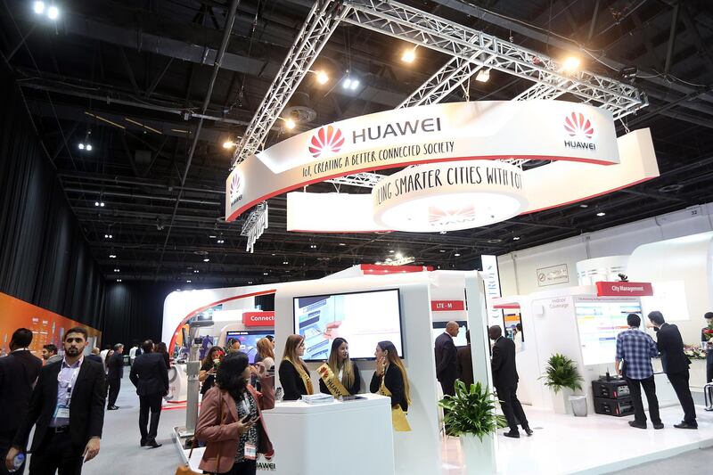 Dubai ,United Arab Emirates- June, 08, 2015:  Visitors browse the Huawei stand during the The Internet of Things Expo ( IOTX) at the World Trade Centre in Dubai .  ( Satish Kumar / The National ) For Business / Story by John Everington *** Local Caption ***  SK-IOTX-08062015-09.jpg