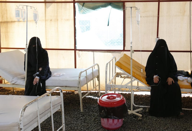Two cholera-infected women receive treatment inside a makeshift tent at a facility in Sana'a, Yemen.  EPA
