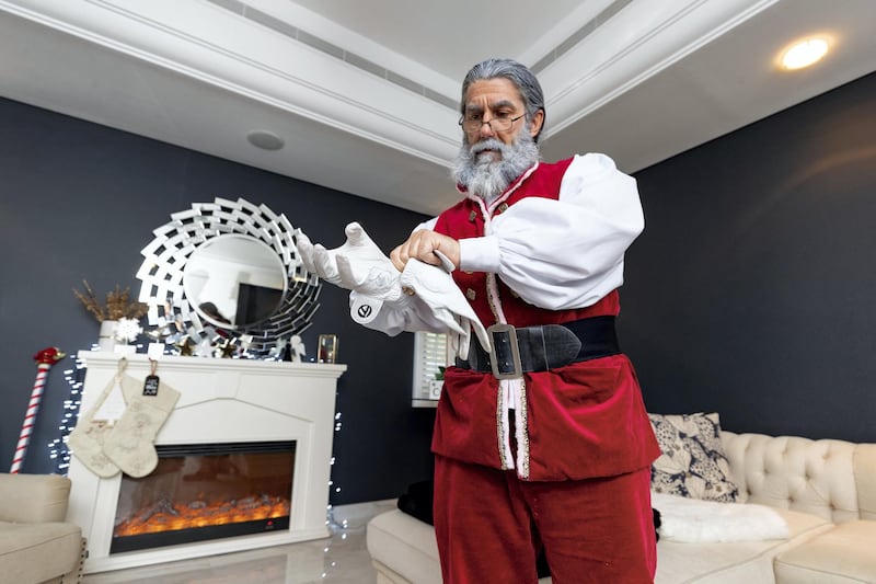 Dubai, United Arab Emirates - December 14, 2020: Lifestyle. Santa played by Keith Dallison gets ready. Santa is doing home visits with Covid-19 prevention measures in place and zoom calls to protect the children. Monday, December 14th, 2020 in Dubai. Chris Whiteoak / The National