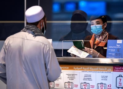 Abu Dhabi, United Arab Emirates, July 8, 2020.   
Abu Dhabi International Airport Media Tour by Etihad.  Passengers at the Etihad Check-In area.
Victor Besa  / The National
Section:  NA 
Reporter: