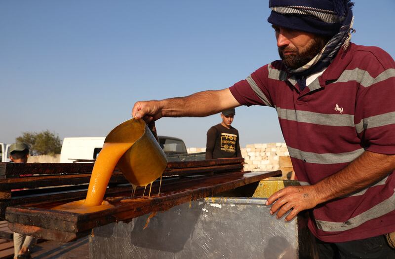 A Syrian from eastern Ghouta makes Qamar Al Din paste in Idlib.