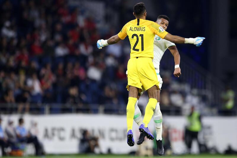 Saudi Arabia goalkeeper Mohammed Alowais and teammate Ali Hadi Albulayhi celebrate. EPA