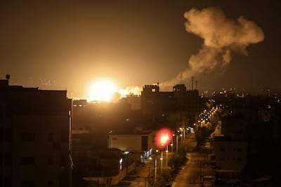 Fire and smoke rise above buildings in Gaza city after Israel launched air strikes on the Palestinian enclave early on Friday. AFP