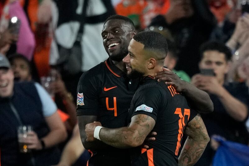 Bruno Martins Indi, left, celebrates with Memphis Depay after the winning goal. AP