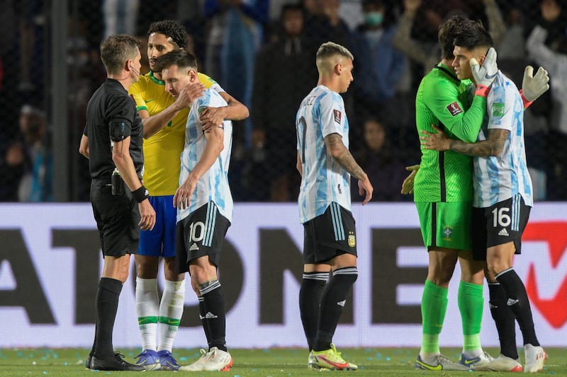 Brazil's Marquinhos and Argentina's Lionel Messi at the end of the game. AFP