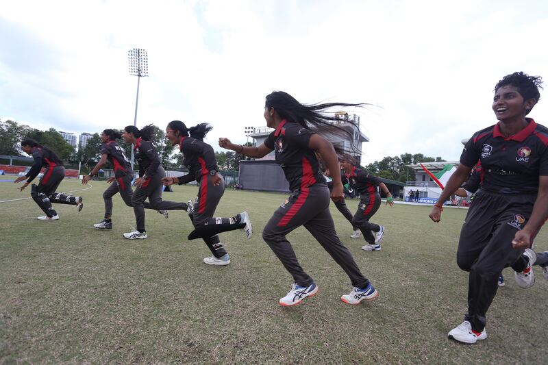 UAE's players race onto the field to celebrate after the winning runs were scored in the final. Photo: Malaysia Cricket Association