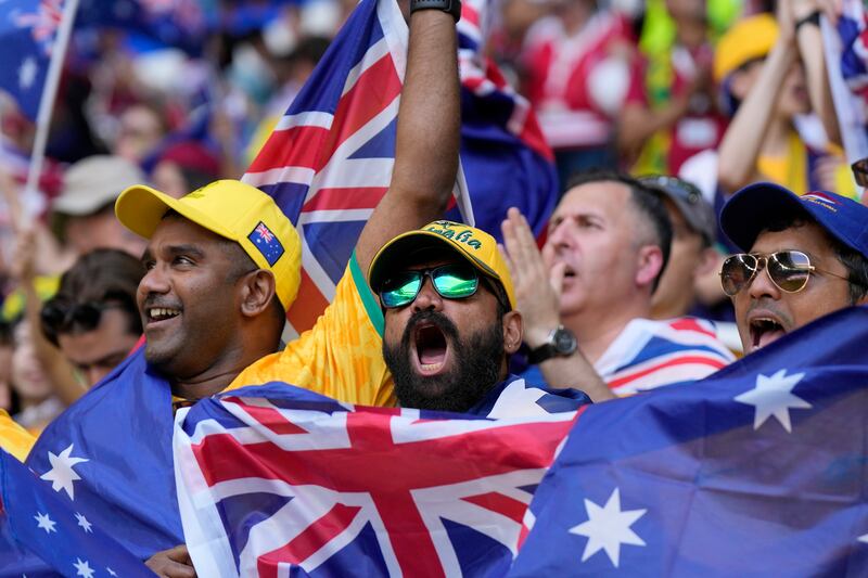 Australia supporters fly the flag at the start of the World Cup Group D match against Tunisia at Al Janoub Stadium in Al Wakrah, Qatar. AP