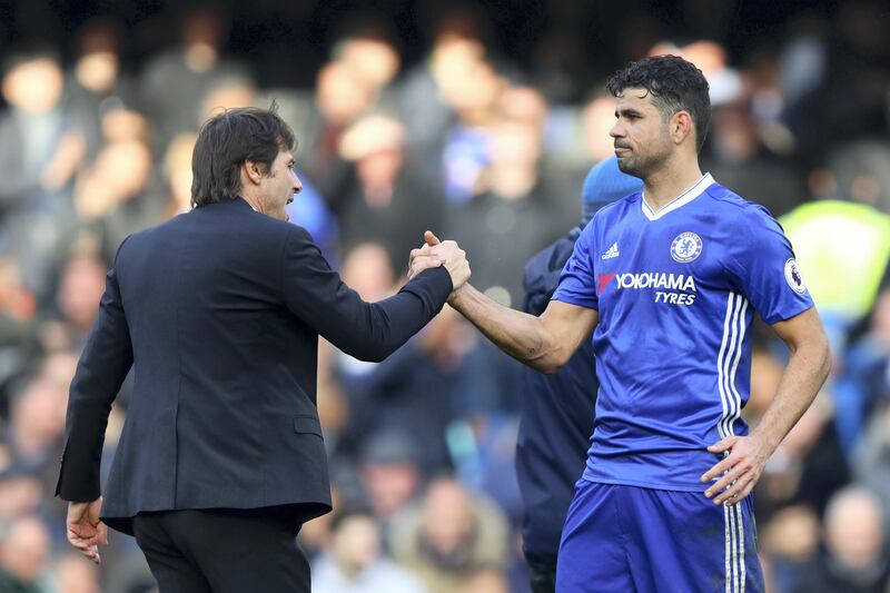 LONDON, ENGLAND - FEBRUARY 04:  Antonio Conte, manager of Chelsea shakes hands with Diego Costa of Chelsea after the Premier League match between Chelsea and Arsenal at Stamford Bridge on February 4, 2017 in London, England.  (Photo by Clive Rose/Getty Images)