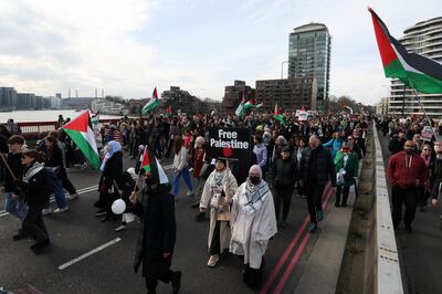 Demonstrators cross Vauxhall Bridge in London to gather outside the US embassy at Nine Elms. Thousands marched from Hyde Park calling for a ceasefire in Gaza. Reuters
