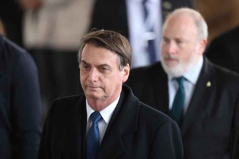 epa07475387 Brazilian President Jair Bolsonaro attends a welcoming ceremony at Ben Gurion International Airport near Tel Aviv, Israel, 31 March 2019. Jair Bolsonaro arrived for a four-day official visit to Israel.  EPA/ABIR SULTAN