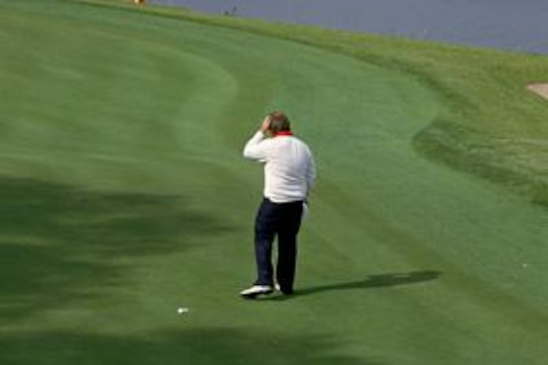 Craig Stadler scratches his head in disbelief after missing the three-foot putt on the 18th green on the second day of the Ryder Cup at The Belfry in September 1985.