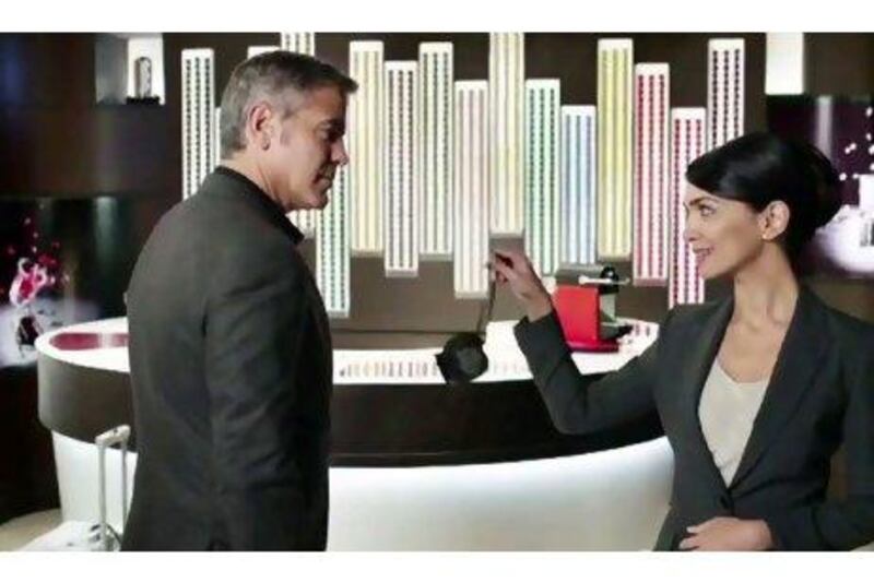 Nazanin Boniadi, pictured here in a scene from the Nespresso commercial starring George Clooney, is one of several high-profile Iranians who have taken to social media to express support for the anti-government protesters taking to the country's streets. Courtesy Nespresso / YouTube