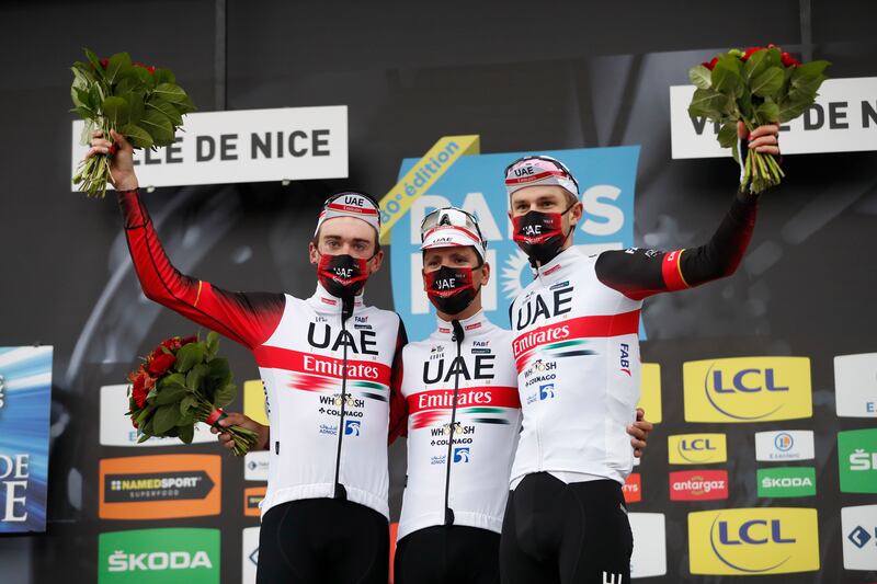 From left, Brandon McNulty, Joao Pedro Goncales Almeida and Finn Fisher-Black of UAE team Emirates celebrates on the podium after winning team general ranking of the Paris-Nice race. AP