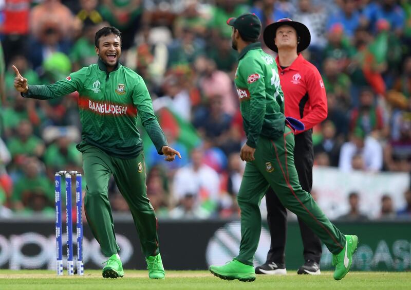 SOUTHAMPTON, ENGLAND - JUNE 24: Shakib Al Hasan (l) of Bangladesh celebrates the wicket of Gulbadin Naib of Afghanistan with Liton Das (r) of Bangladesh during the Group Stage match of the ICC Cricket World Cup 2019 between Bangladesh and South Africa at The Hampshire Bowl on June 24, 2019 in Southampton, England. (Photo by Alex Davidson/Getty Images)