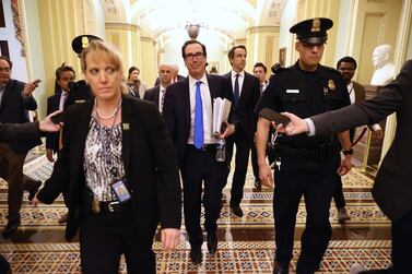 US Treasury Secretary Steven Mnuchin leaves the offices of Minority Leader Charles Schumer as negotiations continued into the night on a $2 trillion economic stimulus in response to the coronavirus pandemic. Democrats twice blocked the package but reached the Senate and Treasury Department reached and agreement on Wednesday. AFP