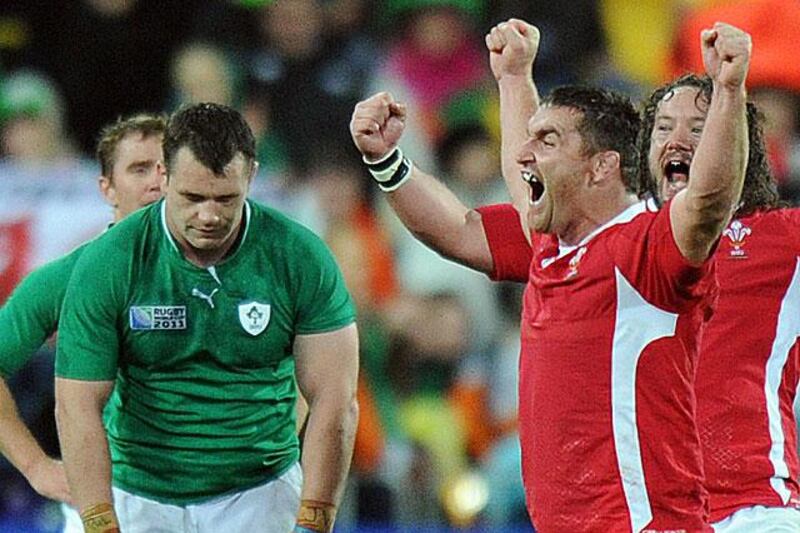 Ciaran Healy, the Ireland prop, left, is dejected at the full-time whistle as Huw Bennett and Adam Jones of the Welsh front row celebrate.

Greg Wood / AFP Photo