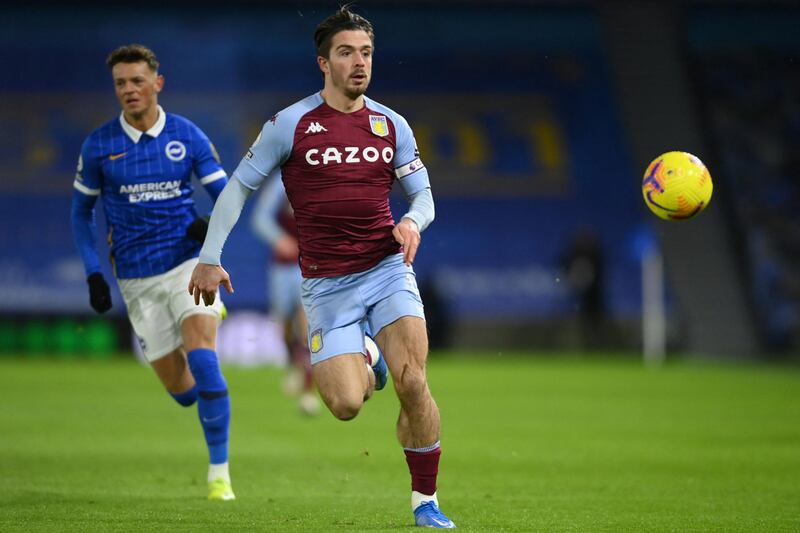 Aston Villa's English midfielder Jack Grealish chases the ball during the English Premier League football match between Brighton and Hove Albion and Aston Villa at the American Express Community Stadium in Brighton, southern England on February 13, 2021. (Photo by Mike Hewitt / POOL / AFP) / RESTRICTED TO EDITORIAL USE. No use with unauthorized audio, video, data, fixture lists, club/league logos or 'live' services. Online in-match use limited to 120 images. An additional 40 images may be used in extra time. No video emulation. Social media in-match use limited to 120 images. An additional 40 images may be used in extra time. No use in betting publications, games or single club/league/player publications. / 