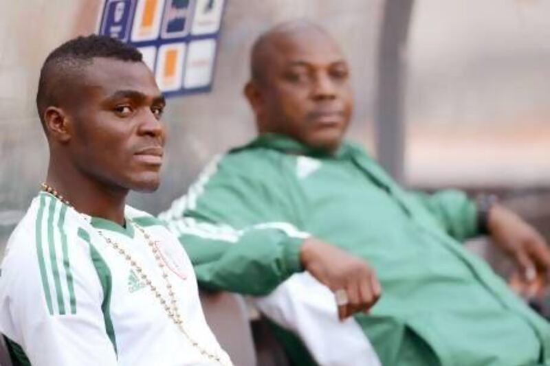 Nigeria's forward Emmanuel Emenike, left, leads Nigeria in scoring but his status for Sunday's final in the African Cup of Nations has not yet been determined. Nigeria coach Stephen Keshi, right, will make a decision before the match. Francisco Leong / AFP