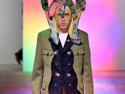 The Comme des Garcons show mixed tailoring with florals