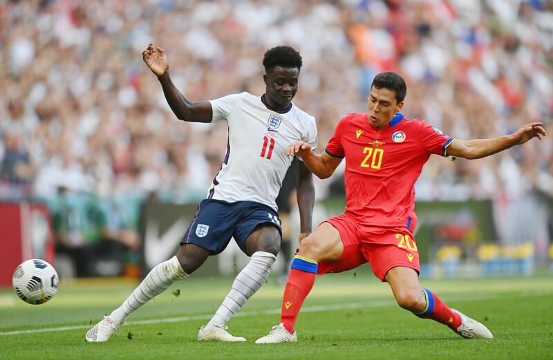 England's Bukayo Saka is challenged by Max Llovera of Andorra. Getty