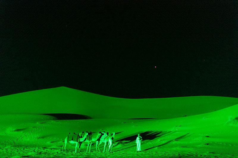 Tourism operator Arabian Adventures arranged for a whole patch of desert to be illuminated in green. Supplied 