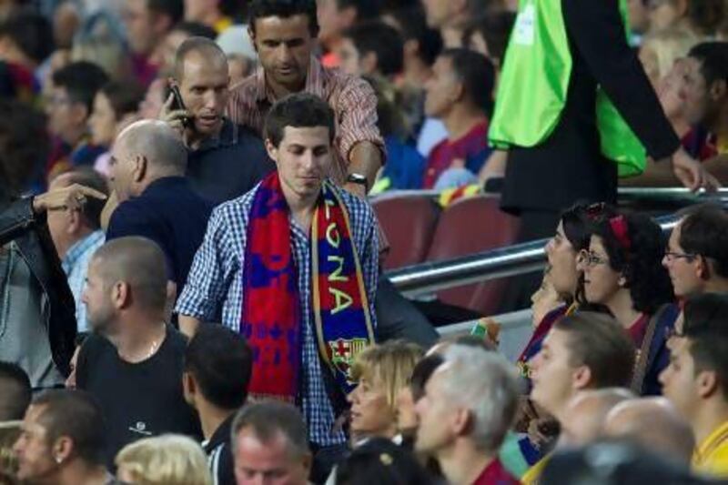 Israeli soldier Gilad Shalit, centre, arrives to take a seat in the grandstand during the match between Barcelona and Real Madrid last October at the Camp Nou. Quique Garcia / AFP