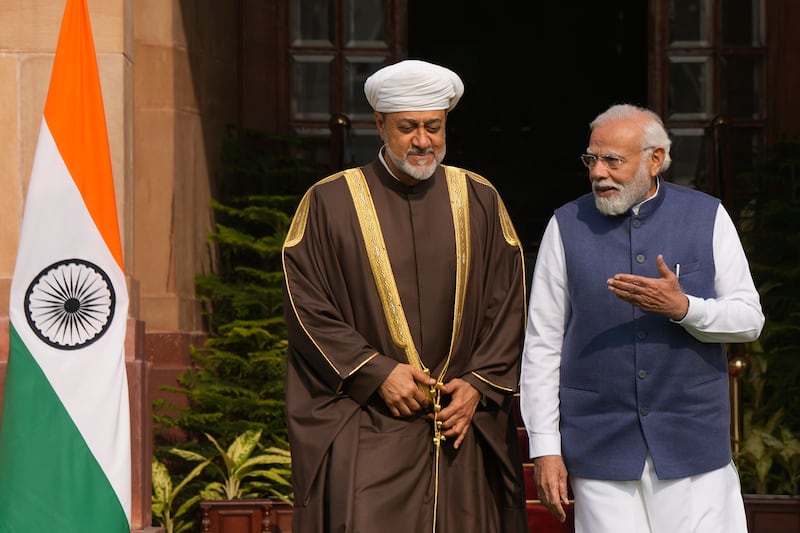 Indian Prime Minister Narendra Modi talks to Sultan Haitham of Oman before their meeting in New Delhi on Saturday.  AP