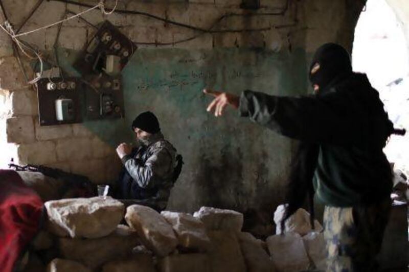 Fighters from Islamist Syrian rebel group Jabhat Al Nusra take their positions on the front line during a clash with Syrian forces in Aleppo.