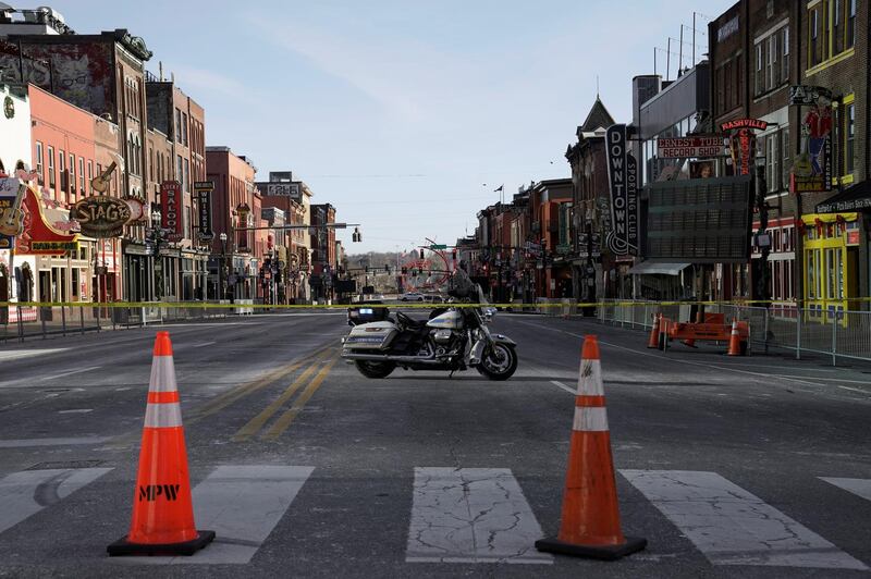 A motorcycle is seen parked on closed Broadway street as investigators work near the site of an explosion from the day before in Nashville, Tennessee, U.S.  REUTERS