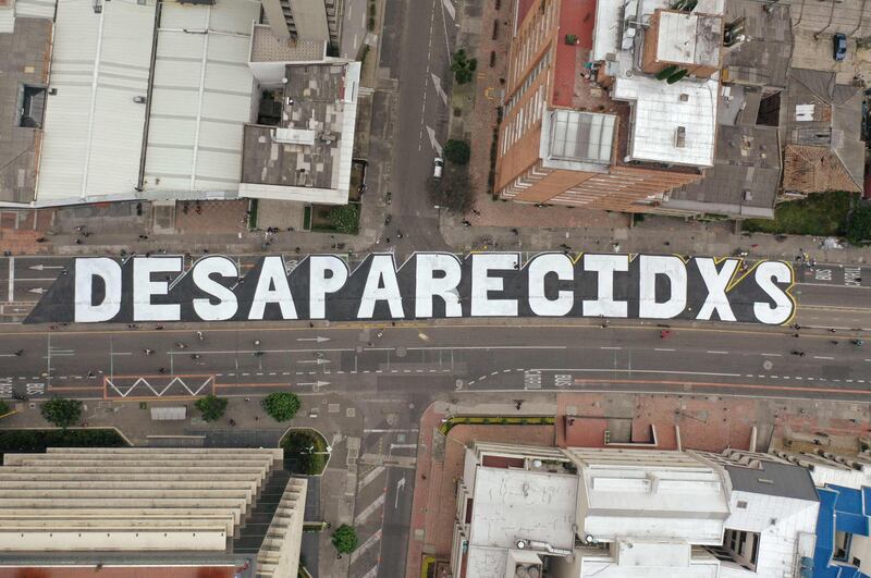 An aerial view of lettering which translates from Spanish as 'Missing Persons', referring to people reported missing during anti-government protests, in Bogota, Colombia. AFP