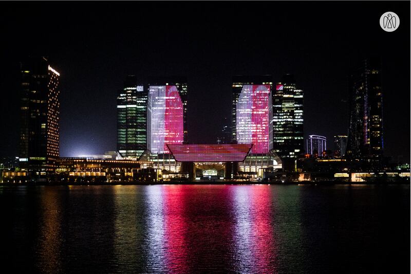 The Galleria on Abu Dhabi's Al Maryah Island is lit up with the Singaporean flag.