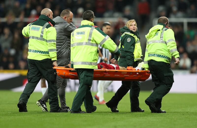 Salah is stretchered off of the pitch after sustaining an injury. Scott Heppell / Reuters