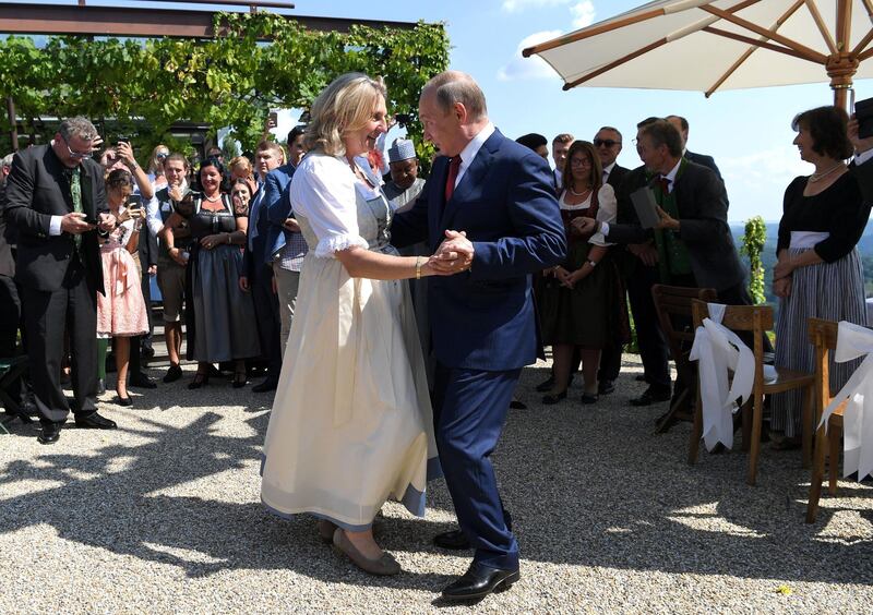 Austria's Foreign Minister Karin Kneissl dances with Russia's President Vladimir Putin at her wedding in Gamlitz, Austria, August 18, 2018. Roland Schlager/Pool via Reuters TPX IMAGES OF THE DAY