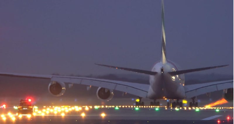 The car gives chase as the Emirates A380 prepares for takeoff. Courtesy Emirates