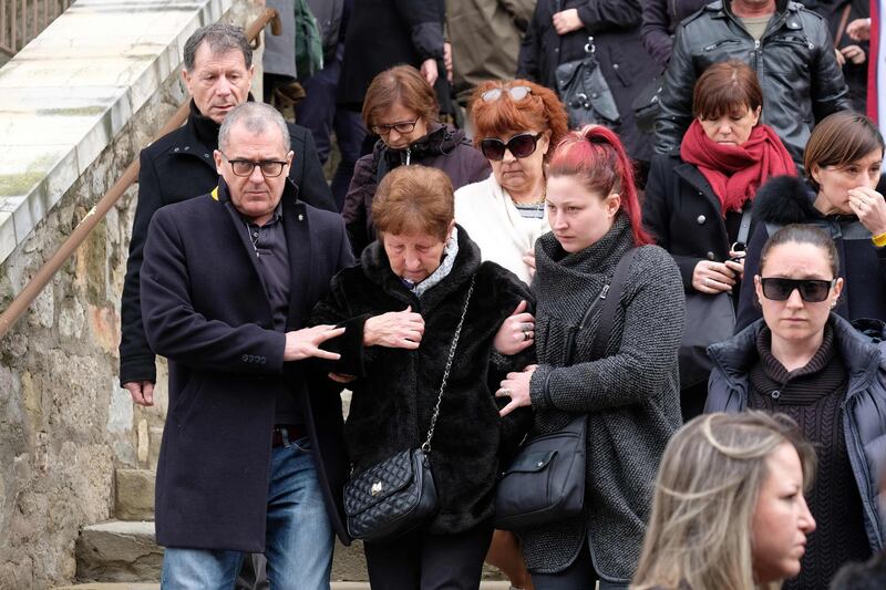 Mourners leave the service of remembrance at the Saint Etienne Church in Trebes in southwest France, on March 25, 2018, two days after a man carried out an attack in which four people were killed.  
Mourners in this rural French town rocked by a deadly Islamist attack held a mass on Palm Sunday to pay tribute to the victims, including a policeman hailed a hero for offering himself in place of a hostage. Lieutenant-Colonel Arnaud Beltrame, 44, was shot and stabbed after taking the place of a woman whom Radouane Lakdim had been using as a human shield during his attack Friday on a supermarket in the small town of Trebes.
 / AFP PHOTO / ERIC CABANIS