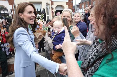 The Princess of Wales smiles and shakes hands with well-wishers after her visit to Pips. EPA