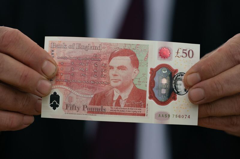 The new 50-pound banknote, featuring an image of World War II code breaker Alan Turing, at Bletchley Park in Bletchley, U.K., on Monday, June 21, 2021. Rollout of the notes starting on June 23 will finish the central bank's switch to currency printed on polymer instead of paper. Photographer: Joe Giddens/PA Wire/Bloomberg
