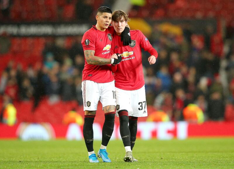 James Garner, rifght, and Marcos Rojo of Manchester United celebrate victory. Getty