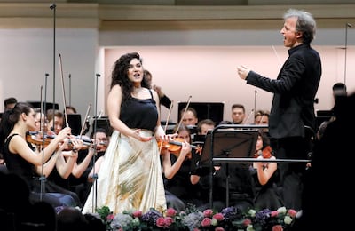 MOSCOW, RUSSIA - MARCH 8, 2020: Soprano Anna Agalatova (L) and French violinist and conductor Jean-Christophe Spinosi perform with the Russian National Youth Symphony Orchestra during a concert at Tchaikovsky Concert Hall. Artyom Geodakyan/TASS (Photo by Artyom Geodakyan\TASS via Getty Images)