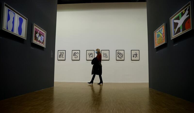epa08759043 A visitor looks at works of art by French artist Henri Matisse, displayed as part of a retrospective exhibition entitled 'Matisse, like a novel' and held at he Pompidou center in Paris, France, 20 October 2020. The exhibition runs from 21 October to 22 February 2021.  EPA-EFE/IAN LANGSDON
