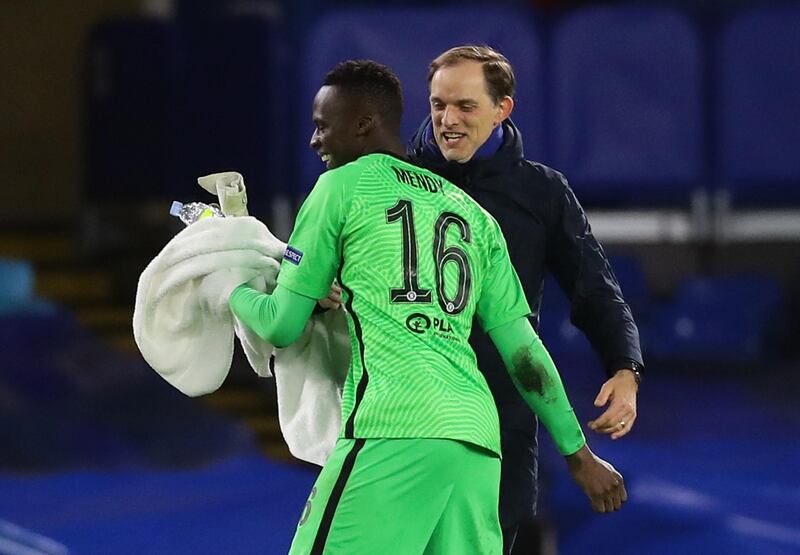 Chelsea manager Thomas Tuchel and goalkeeper Edouard Mendy celebrate after the win over Atletico Madrid. Reuters